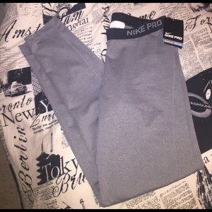 Gray dry-fit Nike Pro training leggings.