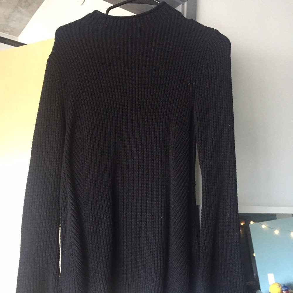 Black sweater with flared arms
