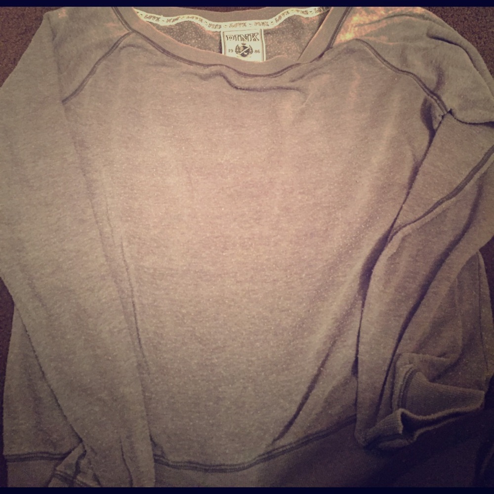Grey sweatshirt with writing on the back