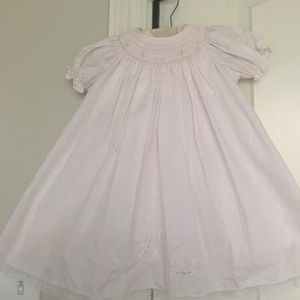 Adorable smocked pale pink newborn dress