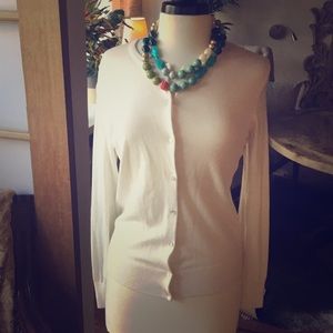 Cream cardigan with pearlized buttons