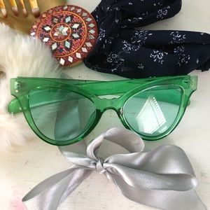 green cat-eye glasses