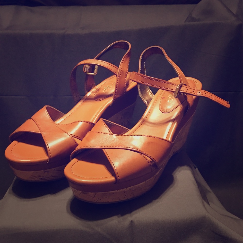 Like new, wore one time tan wedge sandals!