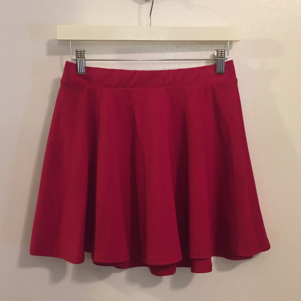 Red, flowy skater skirt, slim around the waist.