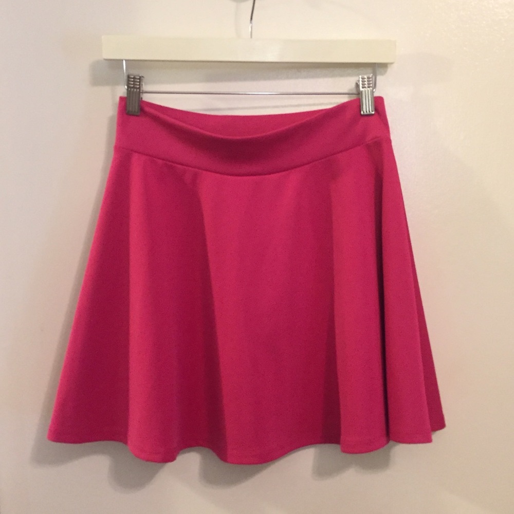 Pink, flowy skater skirt, slim around the waist.