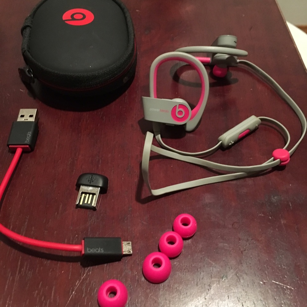 Pink and grey wireless  power beats
