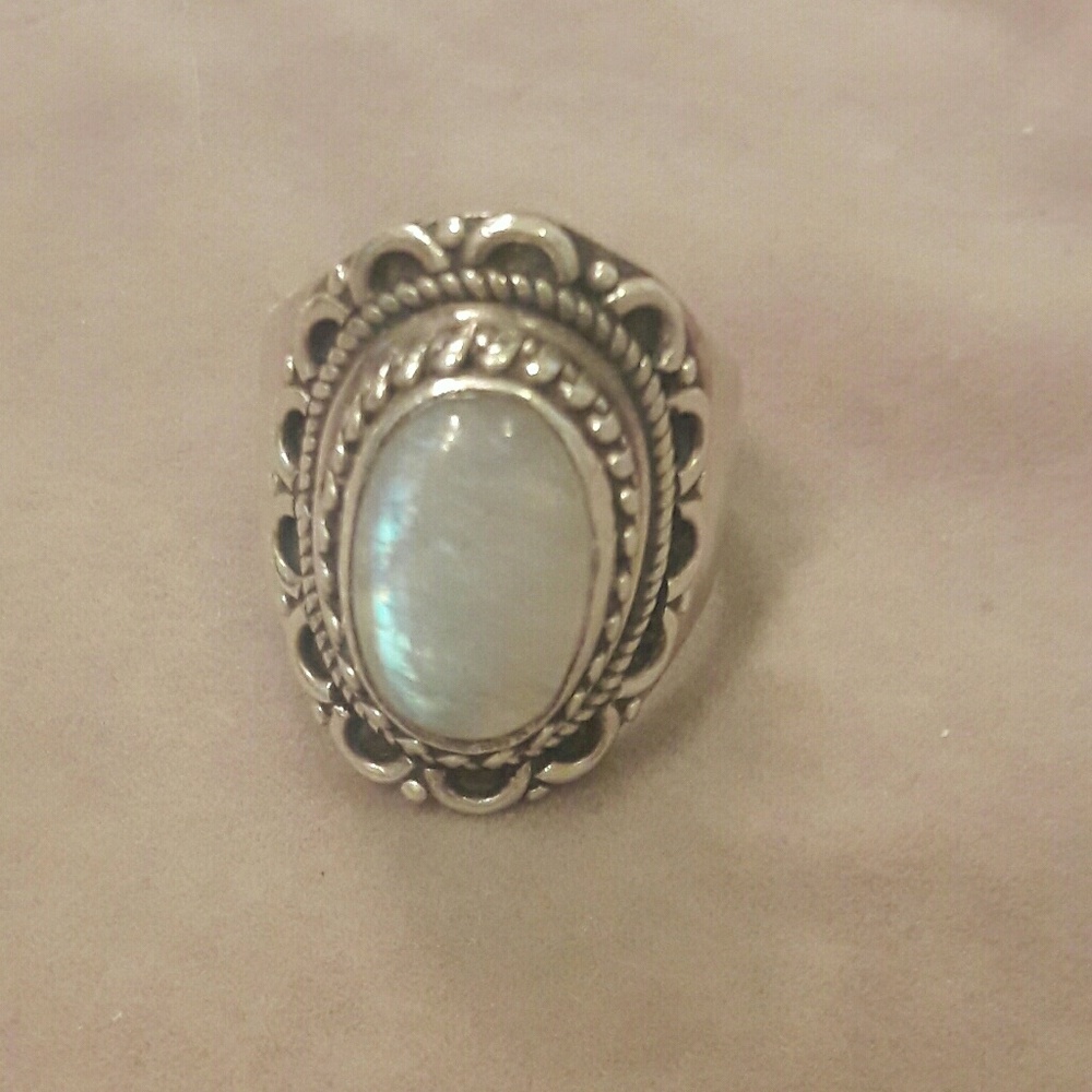 Silver ring with opal-esque stone
