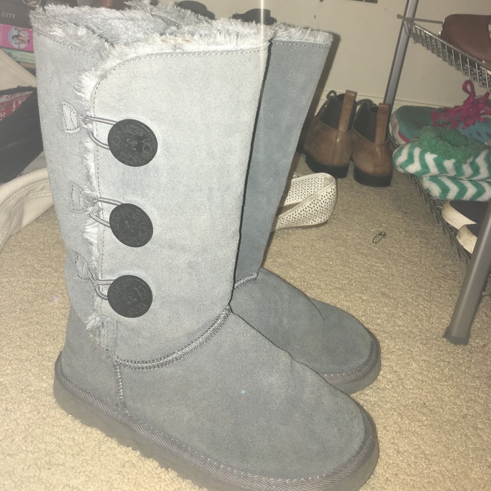 Grey button up Ugg Australia boots.
