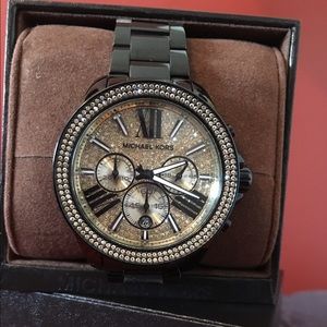 Michael Kors Black and gold watch.