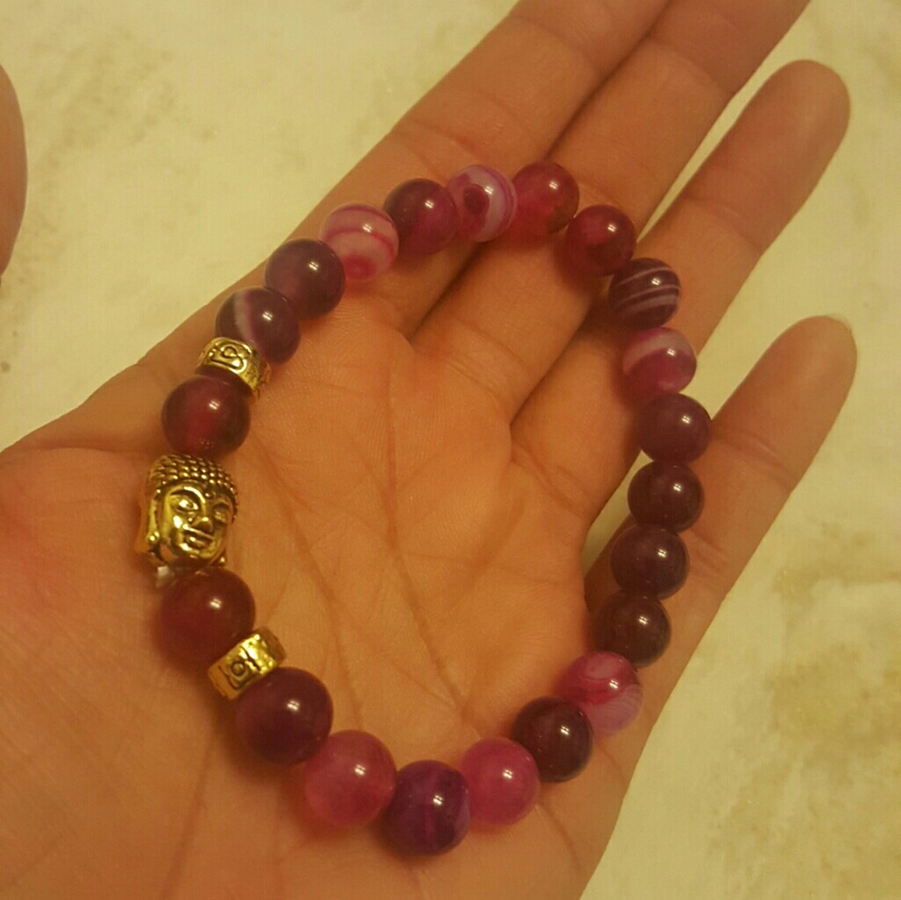 Red stone gold buddha