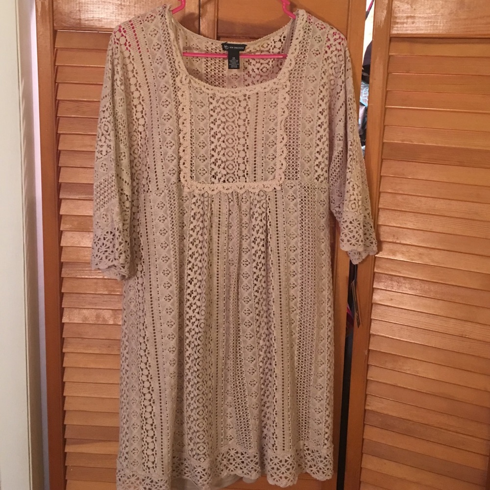 Cream colored lace dress with 3/4 length sleeve