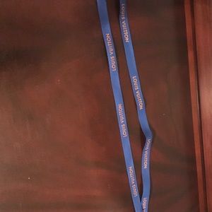 Two Louis Vuitton ribbons .