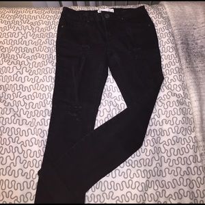 TIlly's black skinny jeans.