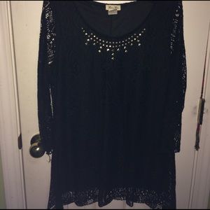 Lacey black shirt with rhinestone neckline.