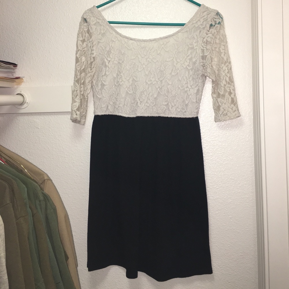 White Lace top dress with short black bottom.