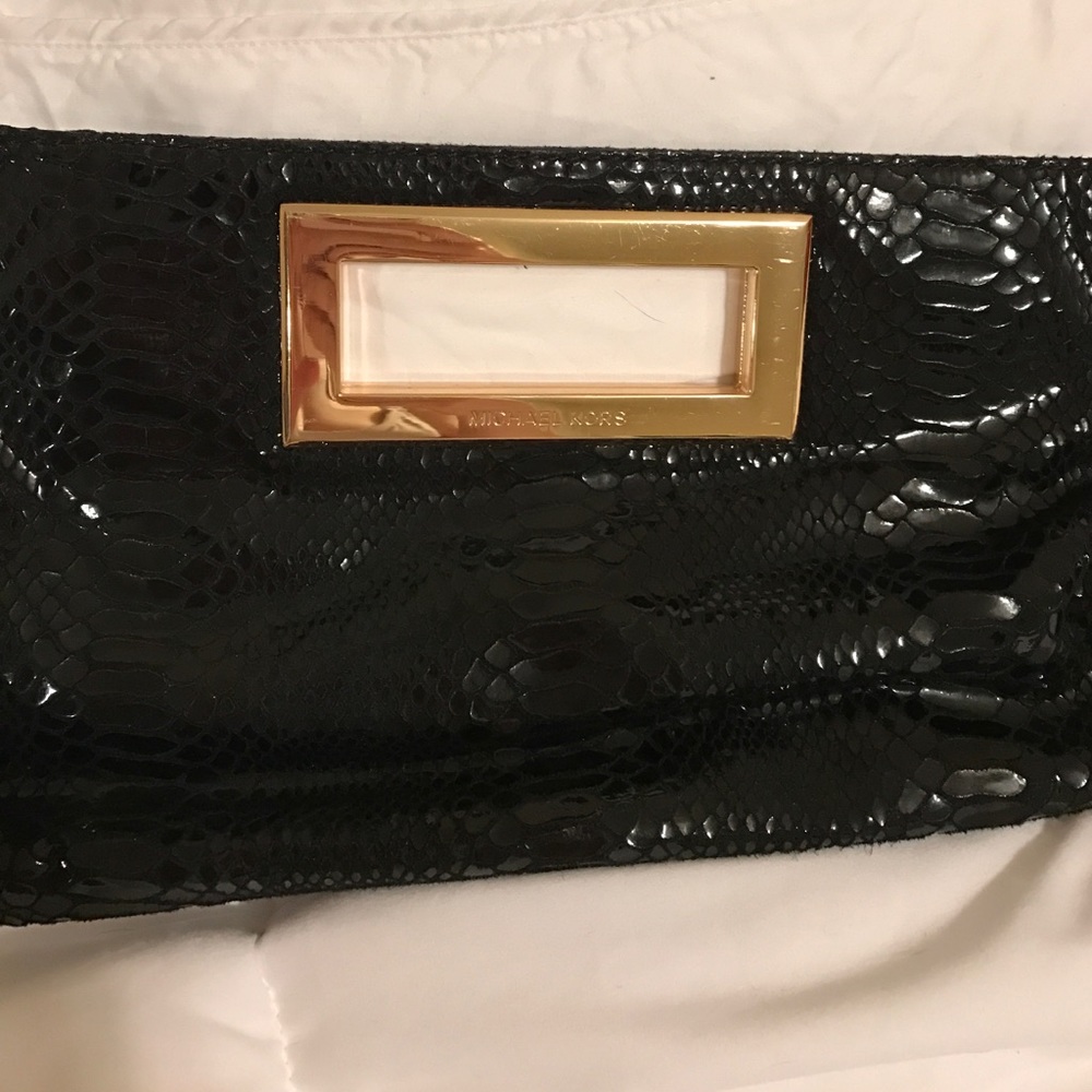 Back and gold Michael Kors clutch