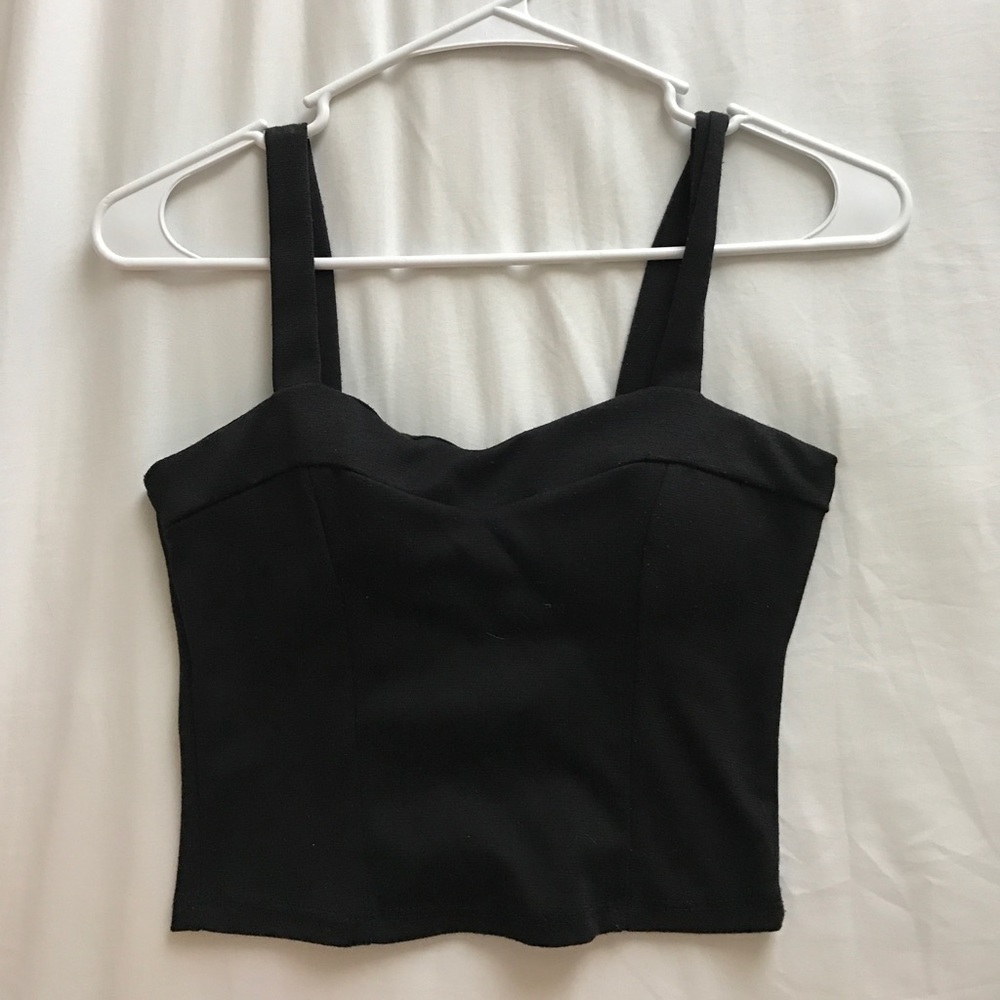 Black crop tank with bow cut outs on the back!