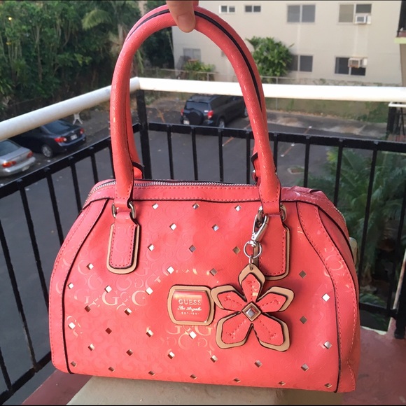 pink guess purse with charms