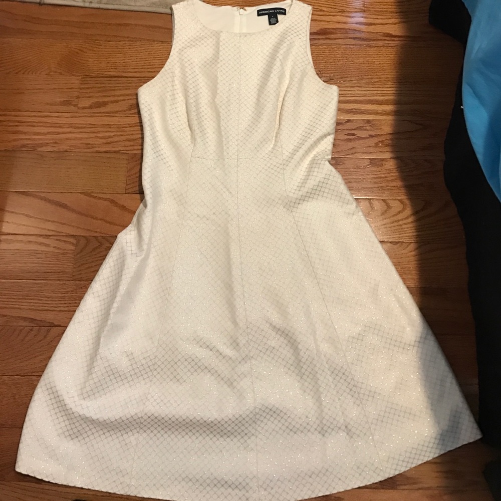 A nice white and gold dress. Worn once.