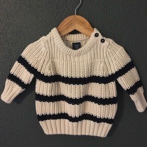 Knit sweater.
