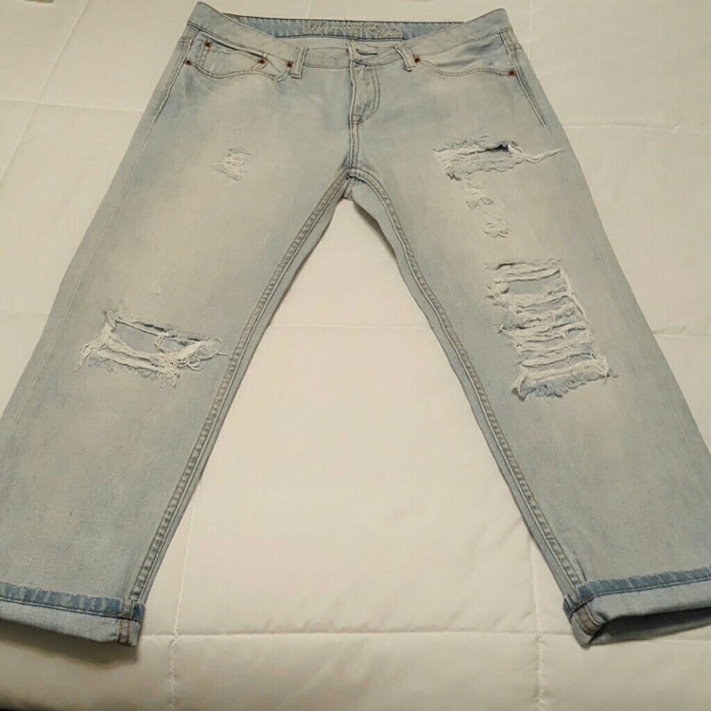 Light wash destroyed boyfriend jeans.