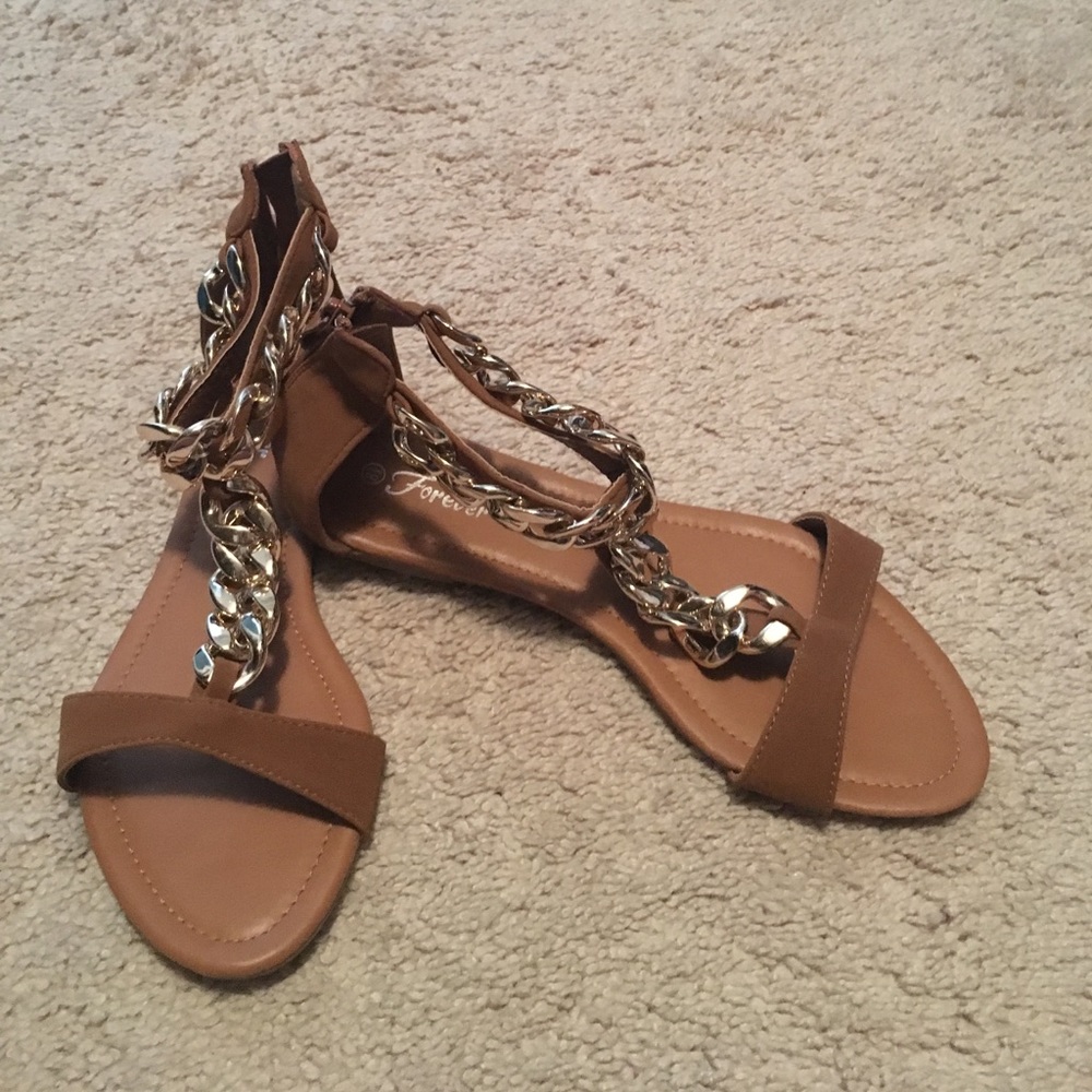 Tan suede with gold chain zip up sandals.