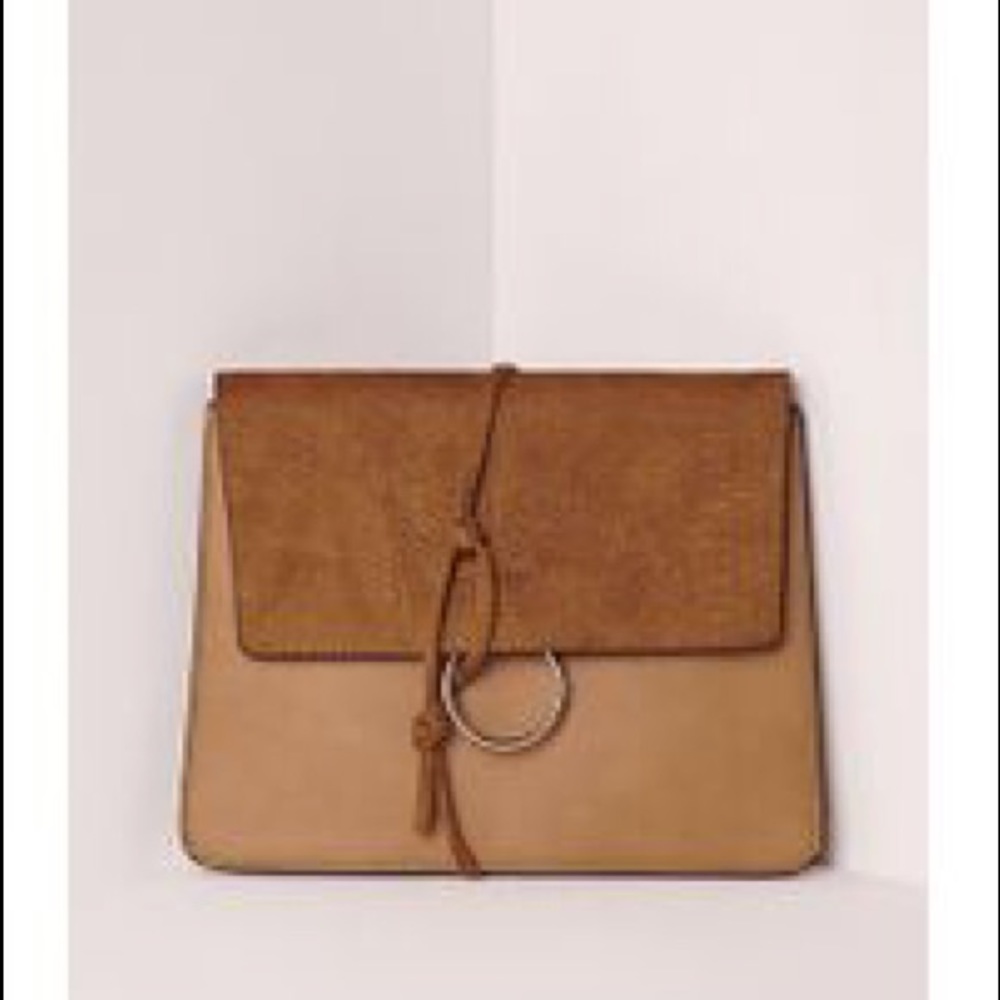 Misguided thread through clutch bag