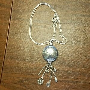 Circle pendant with charms.