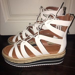 White sandals with blue and white striped platform
