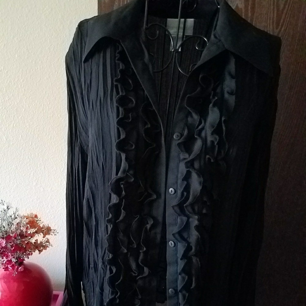 Pretty, black accordion style blouse with ruffles