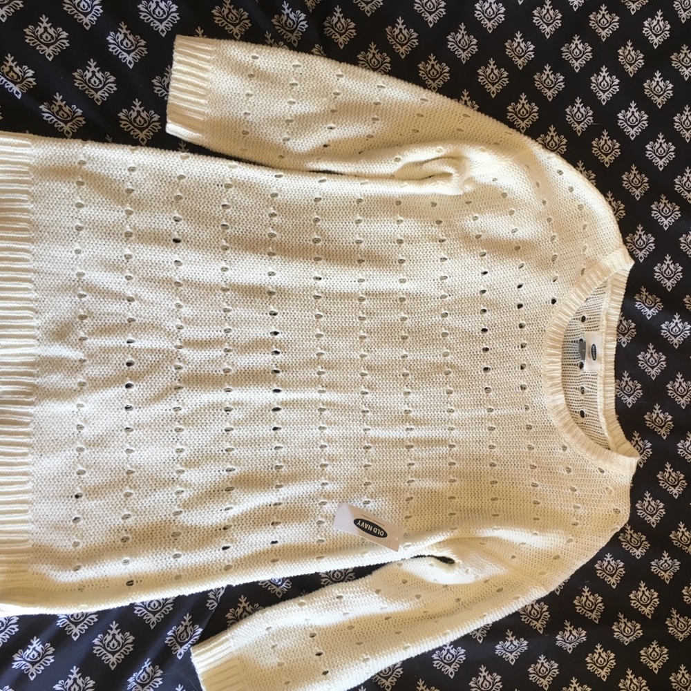 White crocheted like sweater