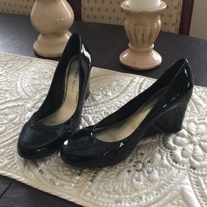 Black patent wedge heels.