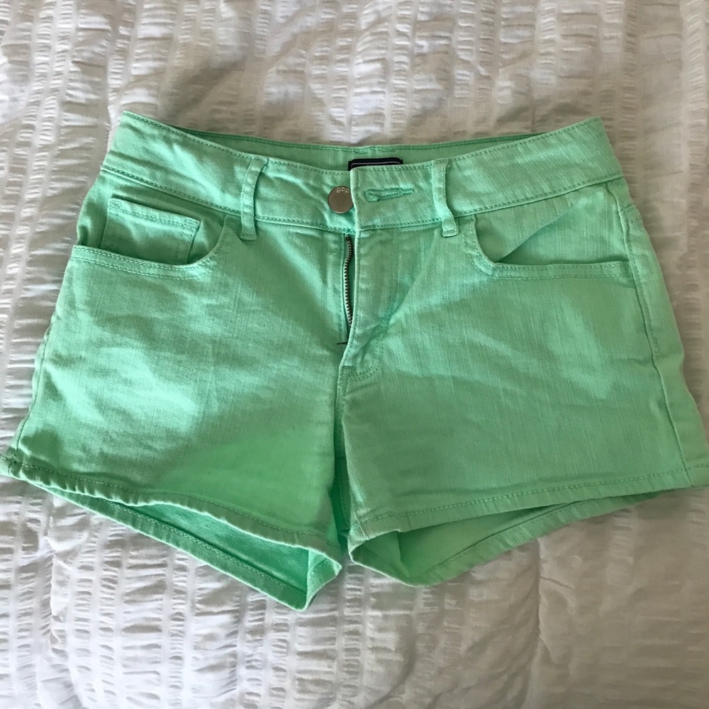 Mint green shorts.