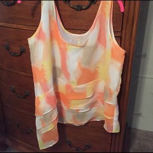 Sleeveless summer shirt with ruffles fully lined.