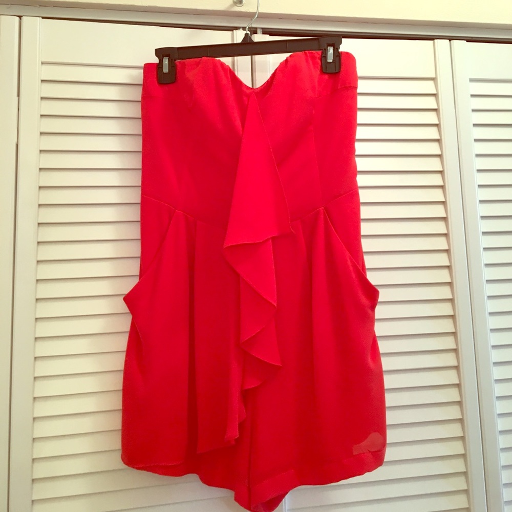 One piece red ruffle shorts romper.