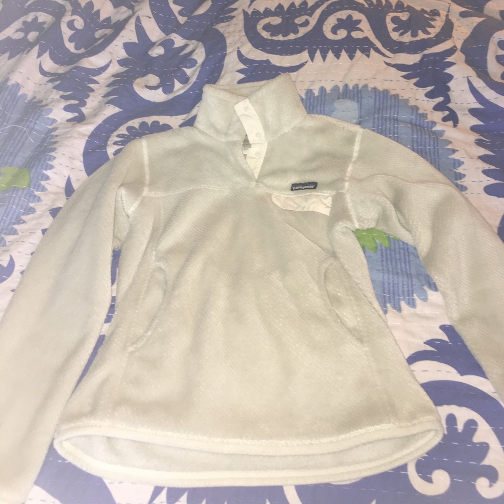 Cream colored Patagonia pullover jacket.