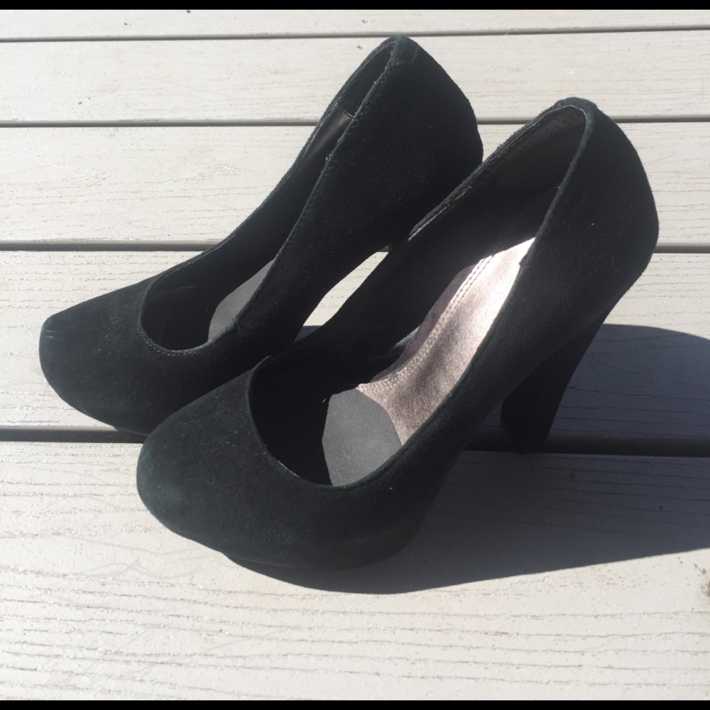 Black suede Mary Jane heels. 8
