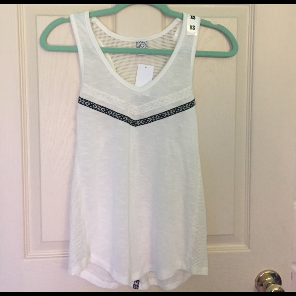 White tank top. Mesh sides and back