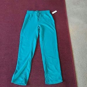 A Turquoise joggers with tag