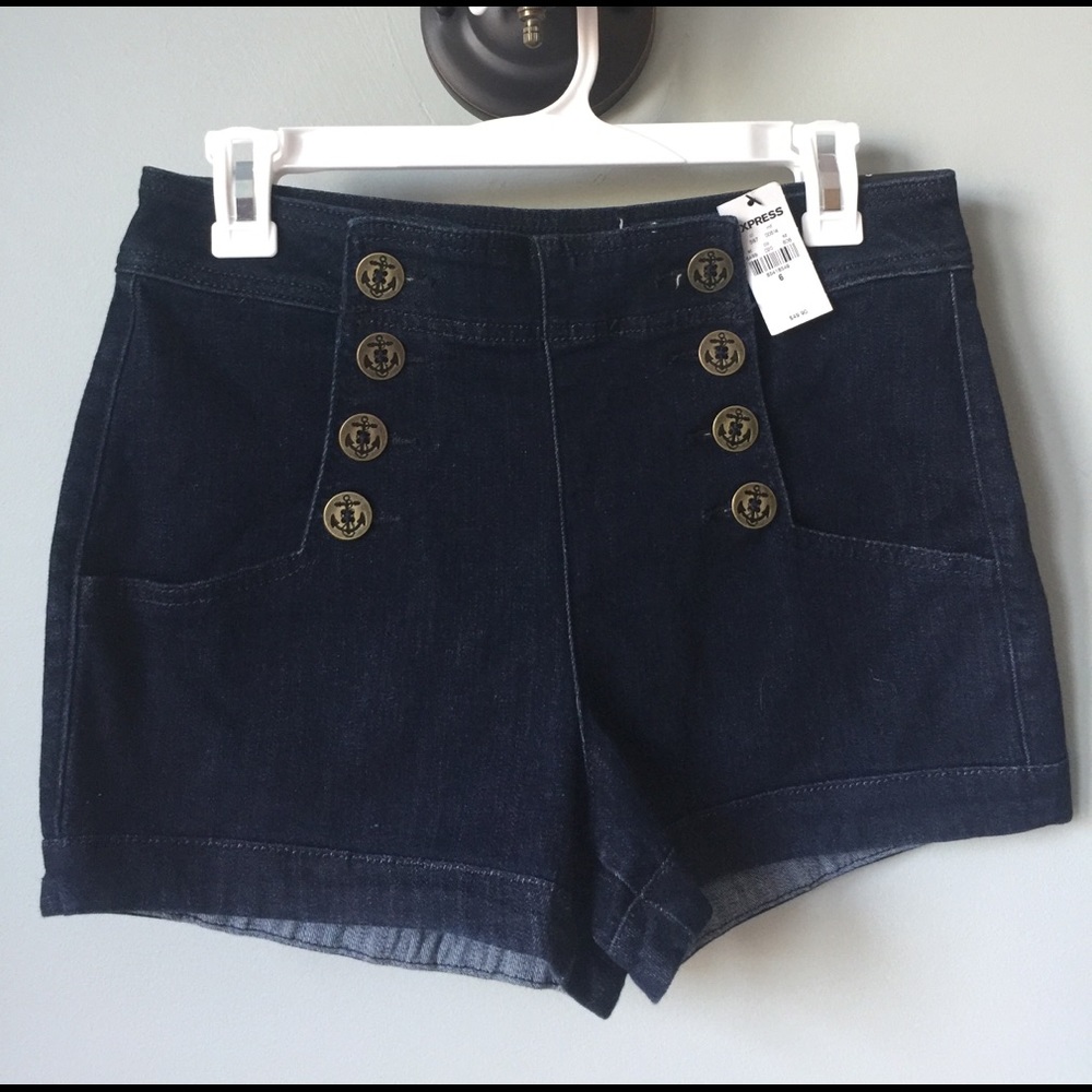 Denim high rise shorts with anchor buttons.