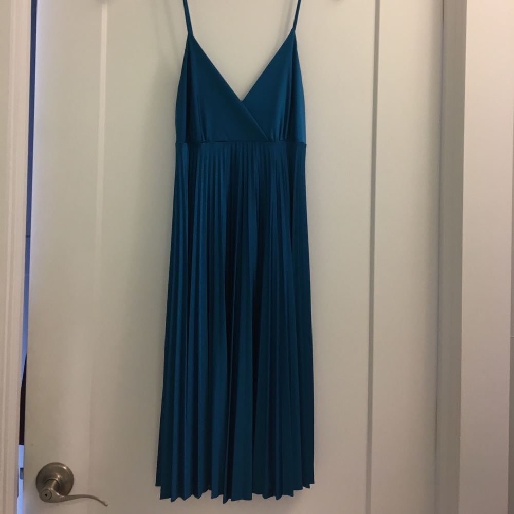 Flirty pleaded turquoise dress