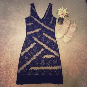 Black-lace dress with nude underlining.