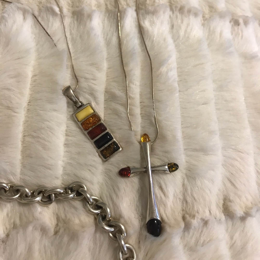 Amber and silver cross.