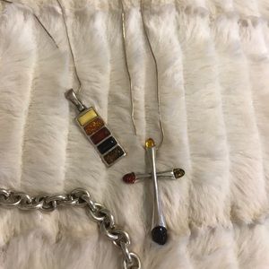 Amber and silver cross.