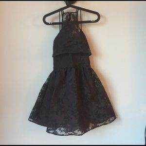 Short black lace dress with black lining inside.