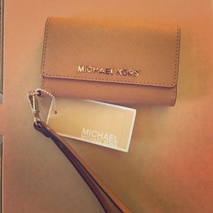 Real leather MK Iphone 5 wristlet New never used.