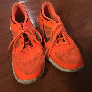 Nike shoes! Bright orange and navy.
