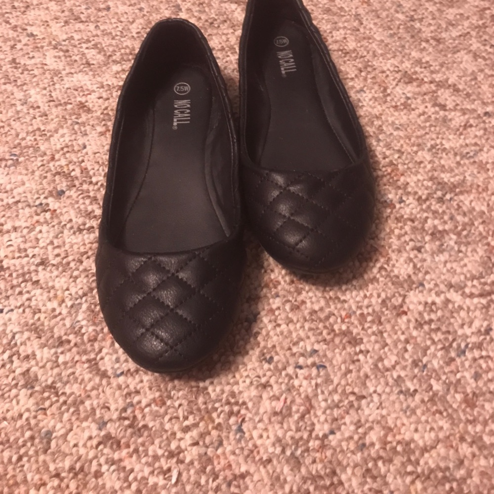 Black leather flats.