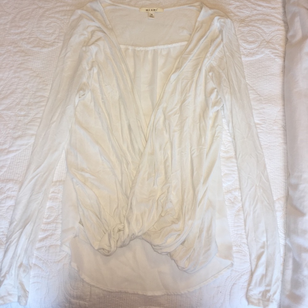 Open v neck white long sleeve.