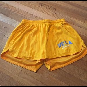 UCLA yellow running shorts